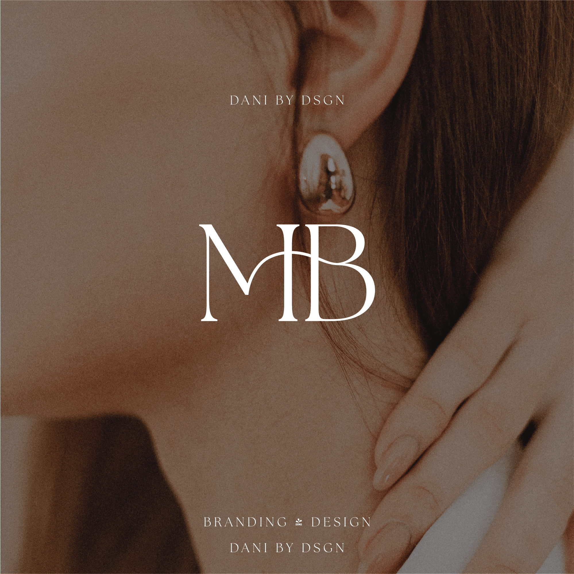 Business Initial Monogram Design: Elegant 'MB' initial monogram by Danibydsgn, showcasing a sophisticated approach to small business branding. This close-up shot, focusing on an elegant lady, embodies refined branding and design services offered by Danibydsgn, a distinguished business logo designer and graphic designer. The business initials logo represents a polished logo suitable for a website brand logo and or clothing branding.