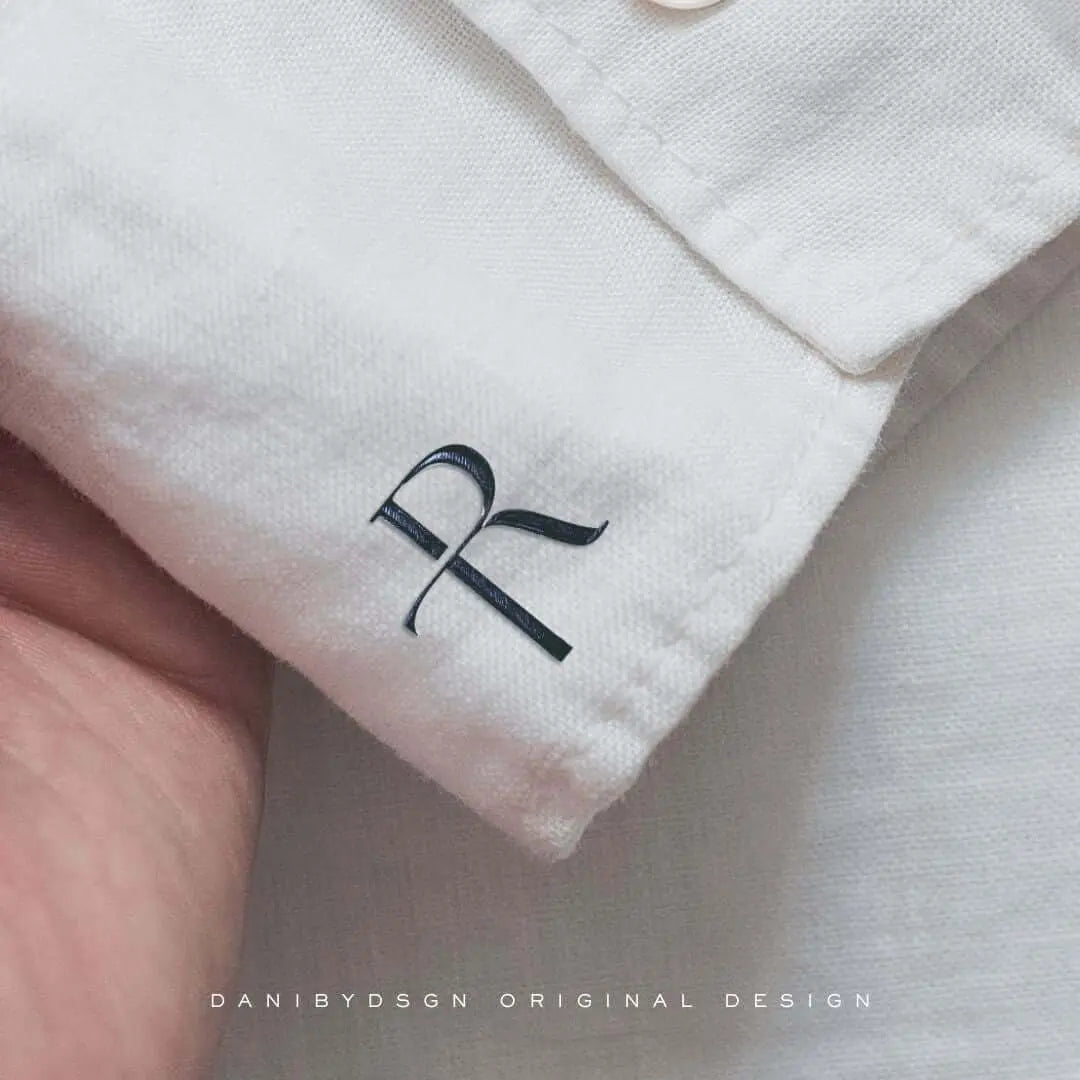 Business initial monogram design by Danibydsgn featuring elegant typography and branding elements for brand identity.