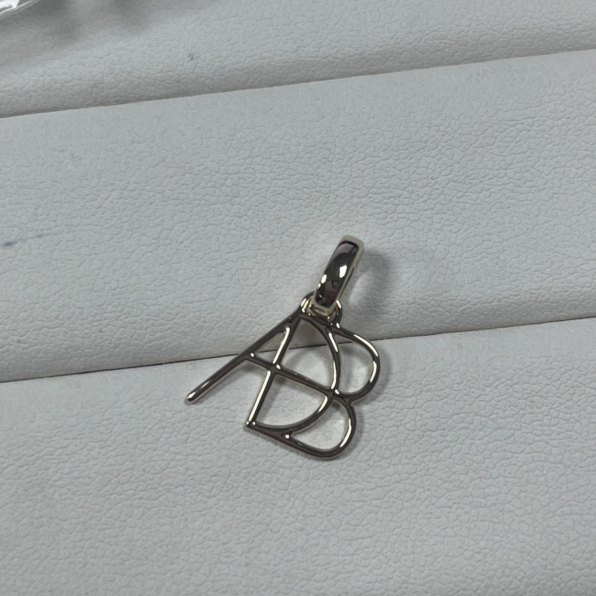 Custom 925 sterling silver Danibydsgn design single symbol clip-on charm. Made to order meaningful jewelry from Danibydsgn.
