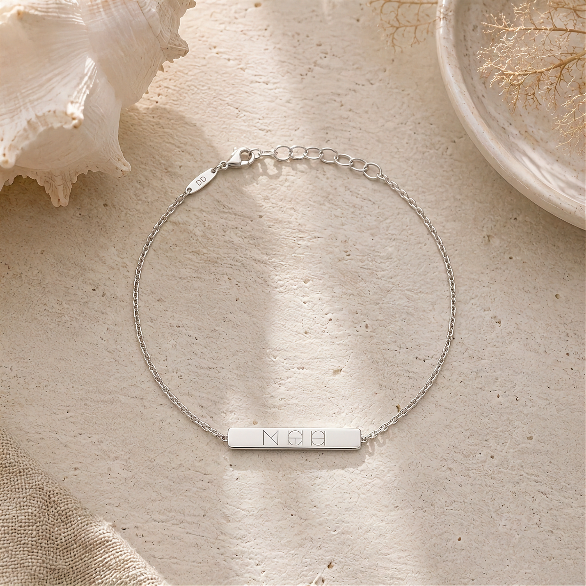 Danibydsgn custom symbol engraved bar bracelet in 925 sterling silver, featuring a cool three symbol design. Meaningful personalized jewelry.