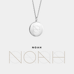 Danibydsgn custom engraved coin necklace in 925 sterling silver featuring the NOAH logo design, displayed on a fine silver chain with matching geometric name artwork below for a cohesive branded presentation.
