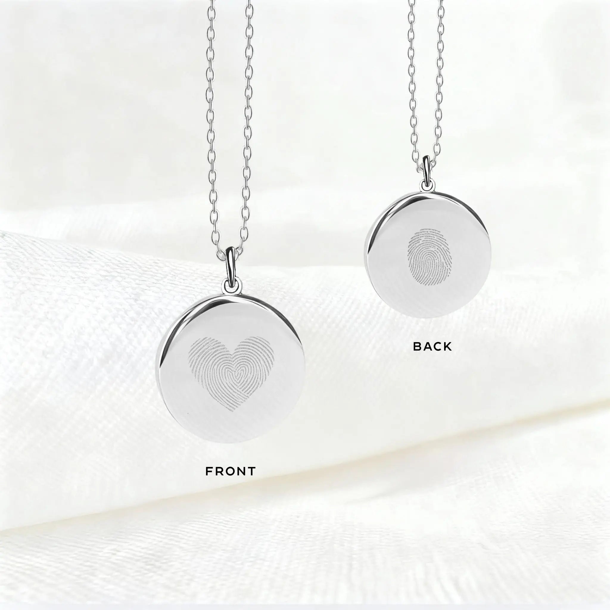 Danibydsgn Heart Fingerprint Necklace in 925 Sterling Silver showing front and back views — featuring a heart-shaped dual fingerprint engraving on the front and a single fingerprint detail on the back for a personal, timeless keepsake.