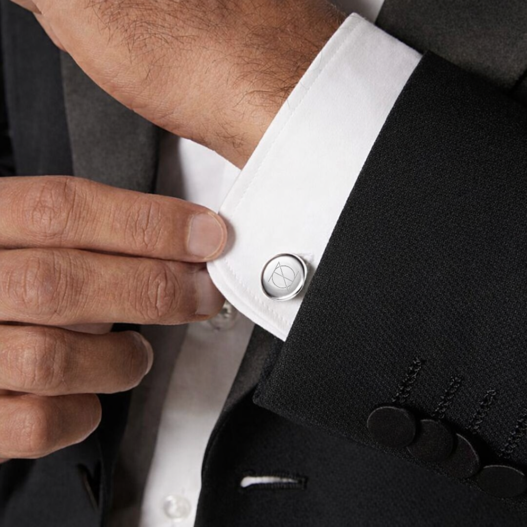 Engraved 925 sterling silver cufflinks by Danibydsgn, showcasing a mininalist, symbol design and polished finish on the cuff of a gentleman.