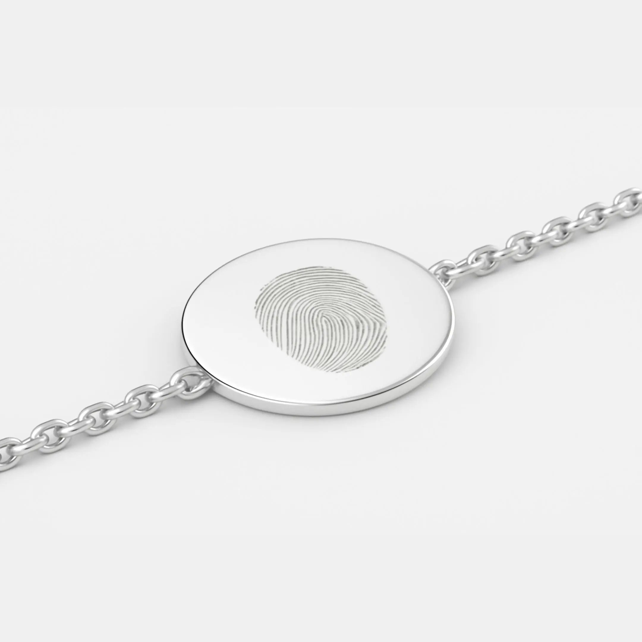 Single fingerprint coin bracelet in 925 sterling silver by Danibydsgn, featuring a detailed coin charm.