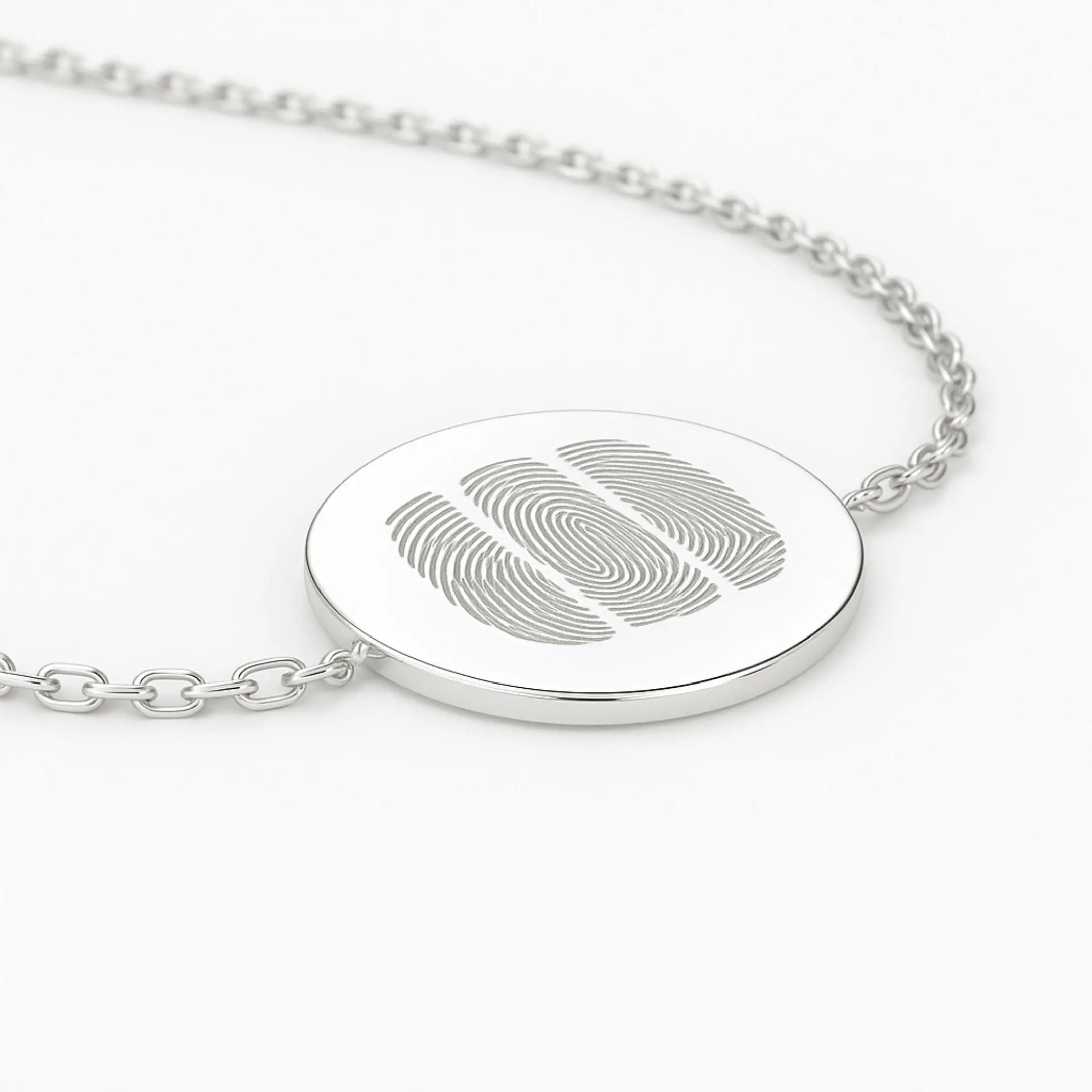 Close-up of Danibydsgn three fingerprint coin bracelet in 925 sterling silver, showcasing intricate details and design.