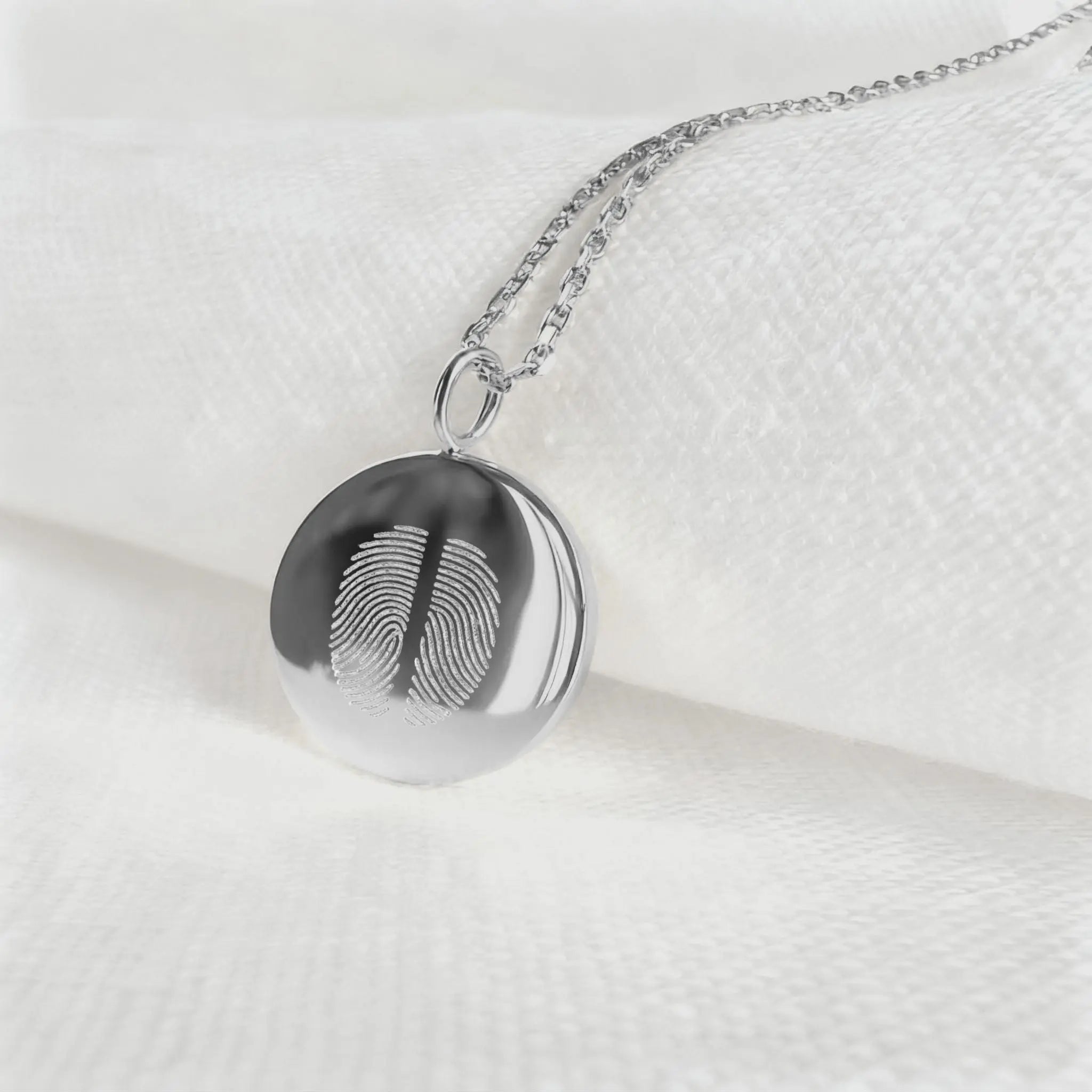 Minimalist two fingerprint coin necklace in 925 sterling silver by Danibydsgn, showcasing delicate design and fine craftsmanship.