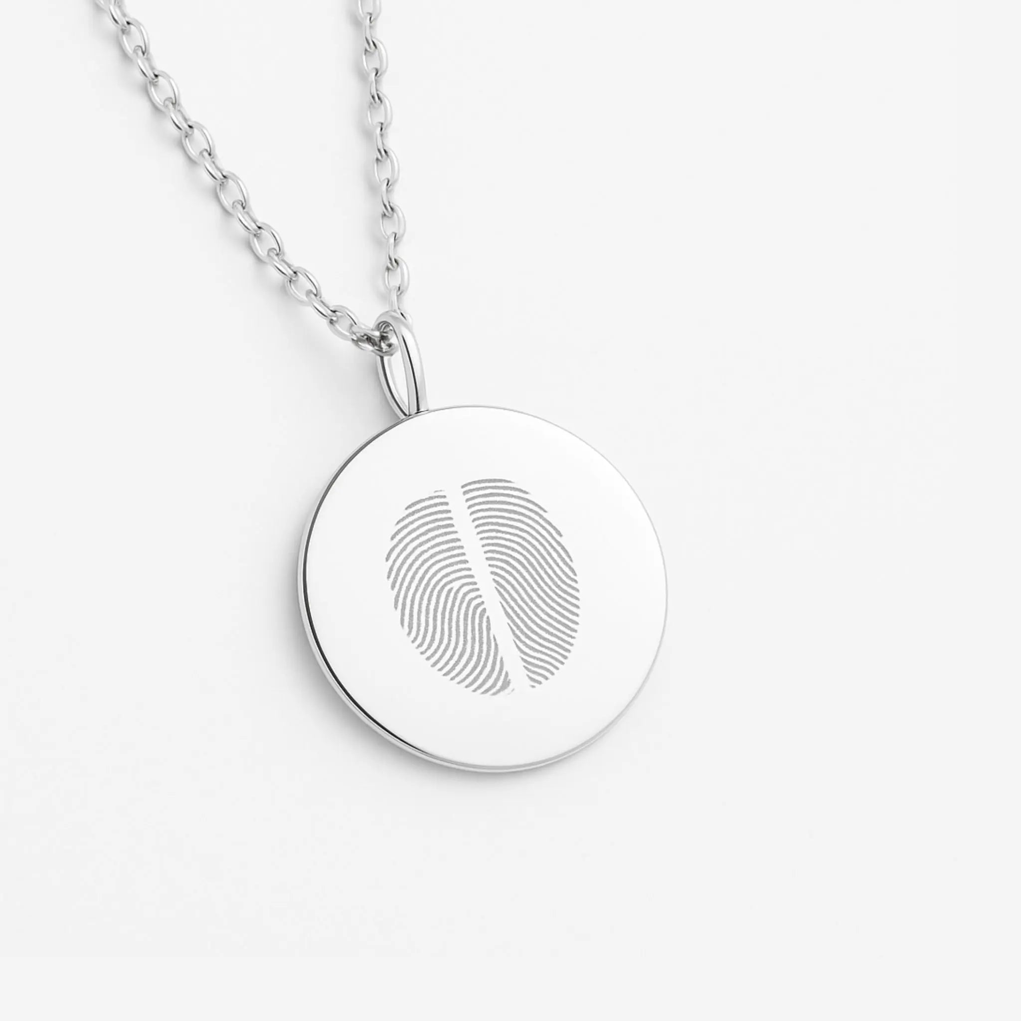 Two Fingerprint Coin Necklace in 925 Sterling Silver by Danibydsgn showcasing intricate fingerprint details.