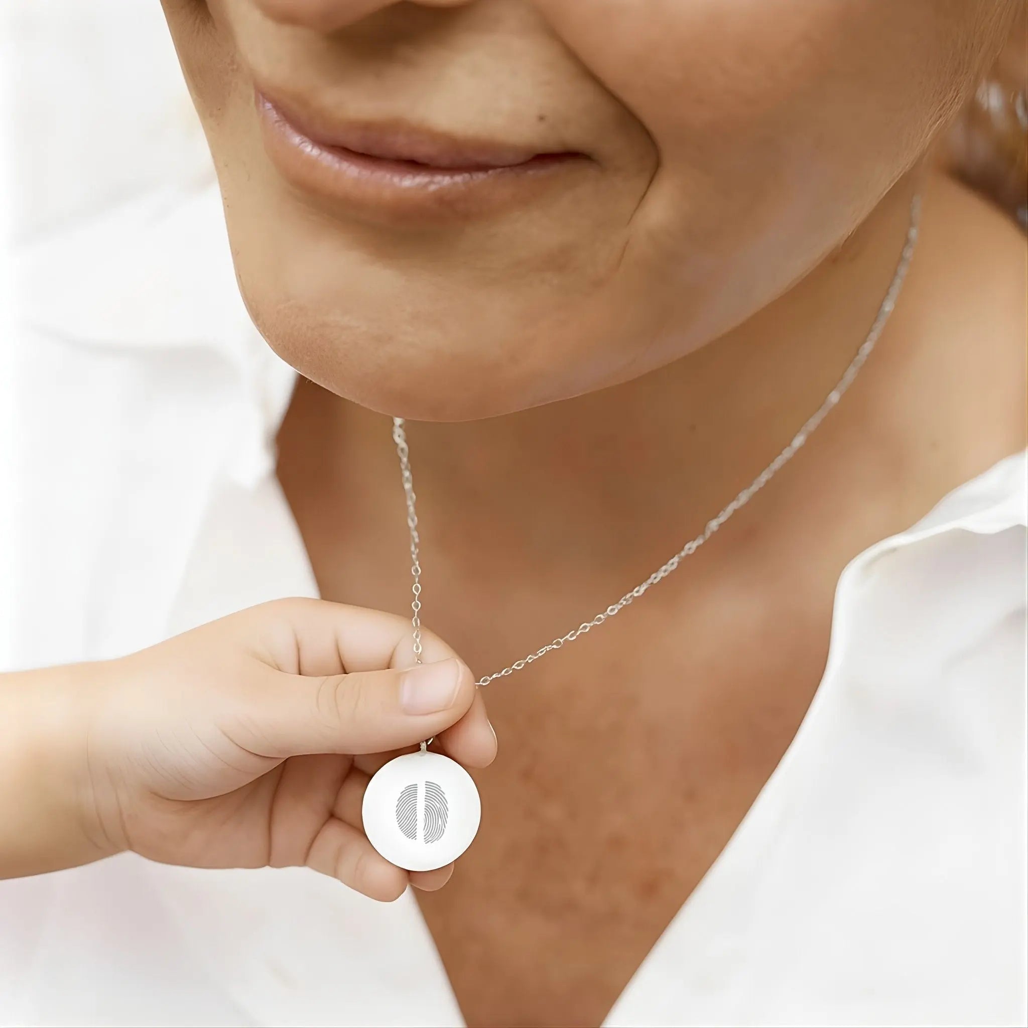 Two Fingerprint Coin Necklace in 925 Sterling Silver by Danibydsgn, showcasing intricate mother-child fingerprint design.
