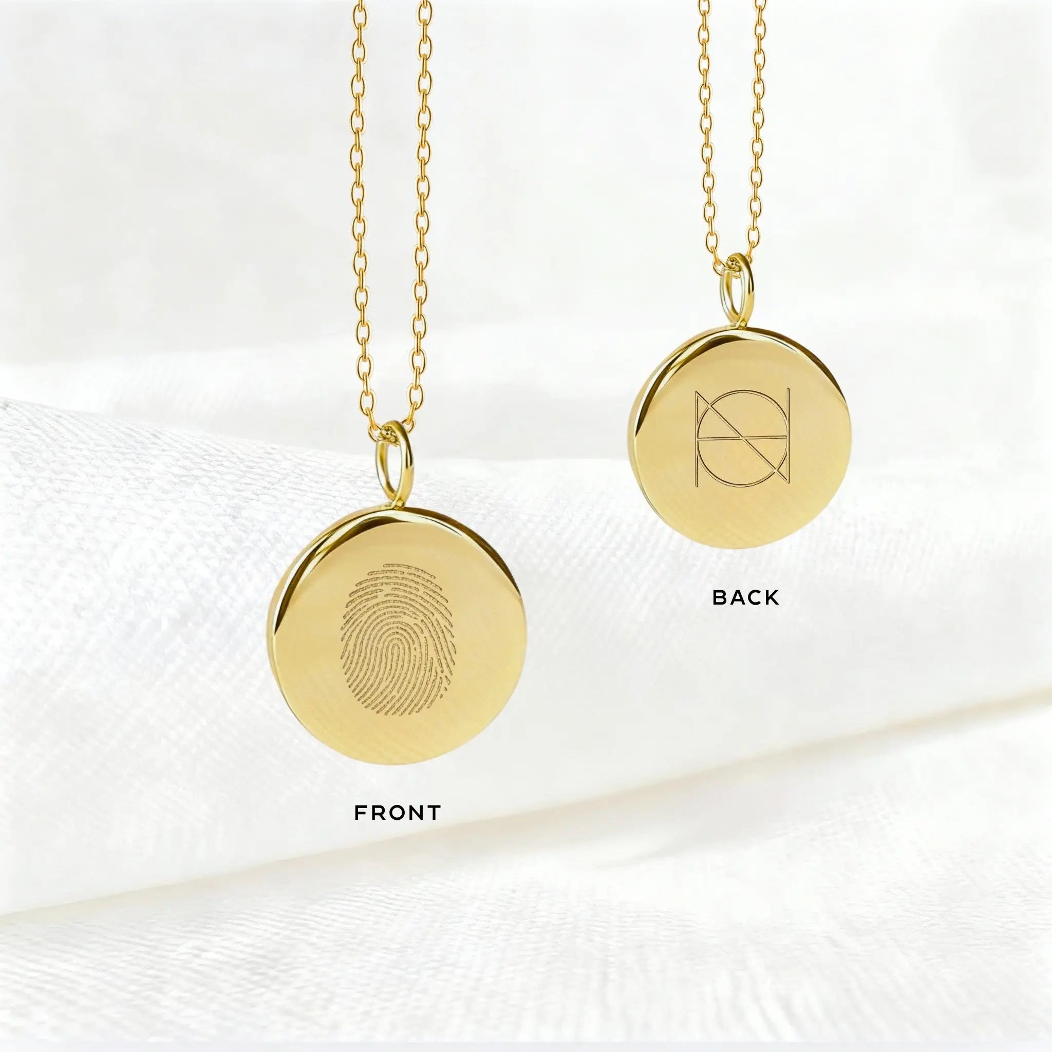 Double-sided engraved pendant necklace in 18k gold vermeil by Danibydsgn with a unique fingerprint design.