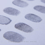 Close-up image of multiple inked fingerprints on paper used for Danibydsgn custom fingerprint art, showing detailed ridge patterns for personalized wall print and home decor creation.