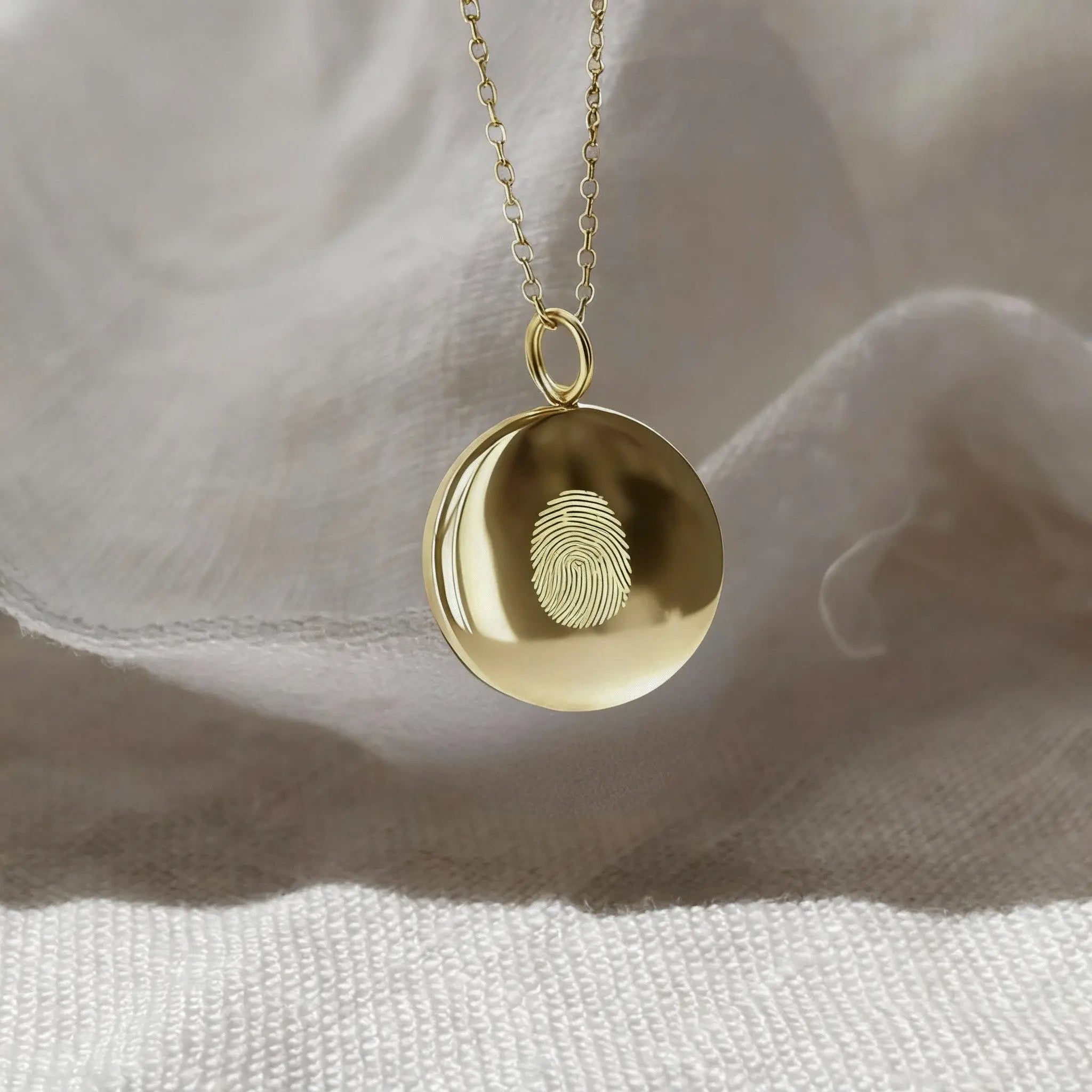 Minimalist single fingerprint coin necklace in 18k gold vermeil by Danibydsgn, showcasing a unique pendant design.