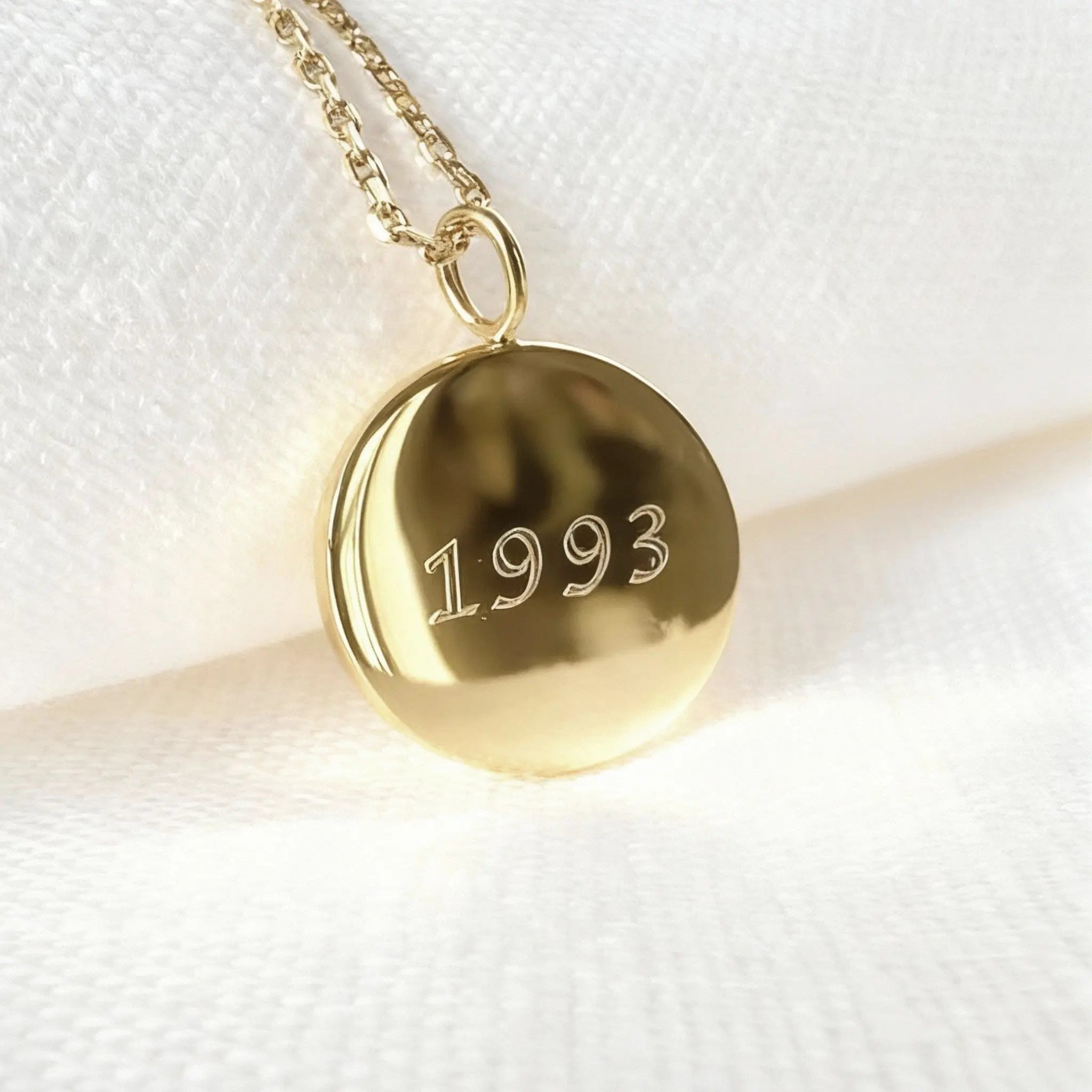 Personalized 18k gold vermeil fingerprint coin necklace by Danibydsgn with date engraving on the back.
