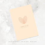 Custom fingerprint heart card by Danibydsgn featuring overlapping fingerprints forming a heart shape with personalized names and date, designed as a meaningful keepsake or romantic gift card.