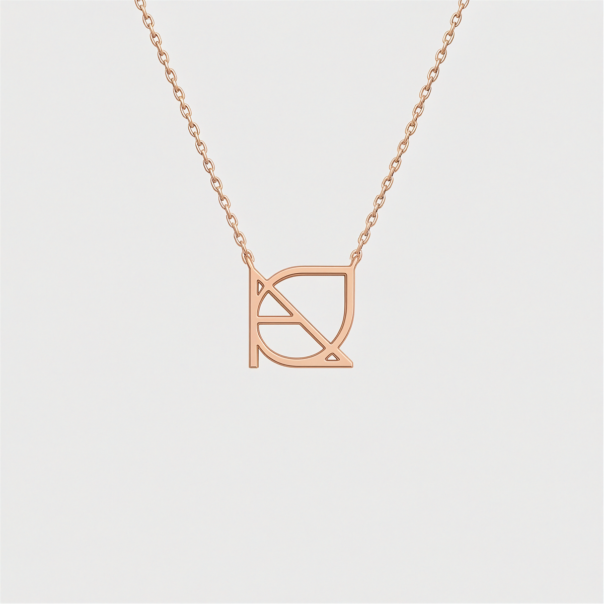 9k rose gold custom Danibydsgn cut-out symbol pendant necklace. Danibydsgn personalized luxury jewelry, minimalist 1cm symbol design on fine chain.