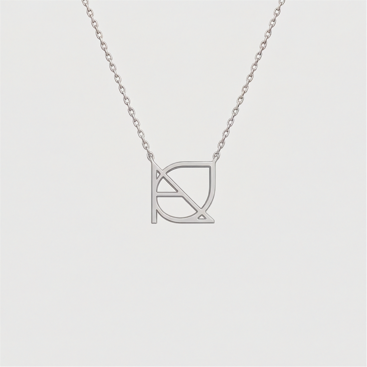 9k white gold custom Danibydsgn cut-out symbol pendant necklace. Danibydsgn personalized luxury jewelry, minimalist 1cm symbol design on fine chain.