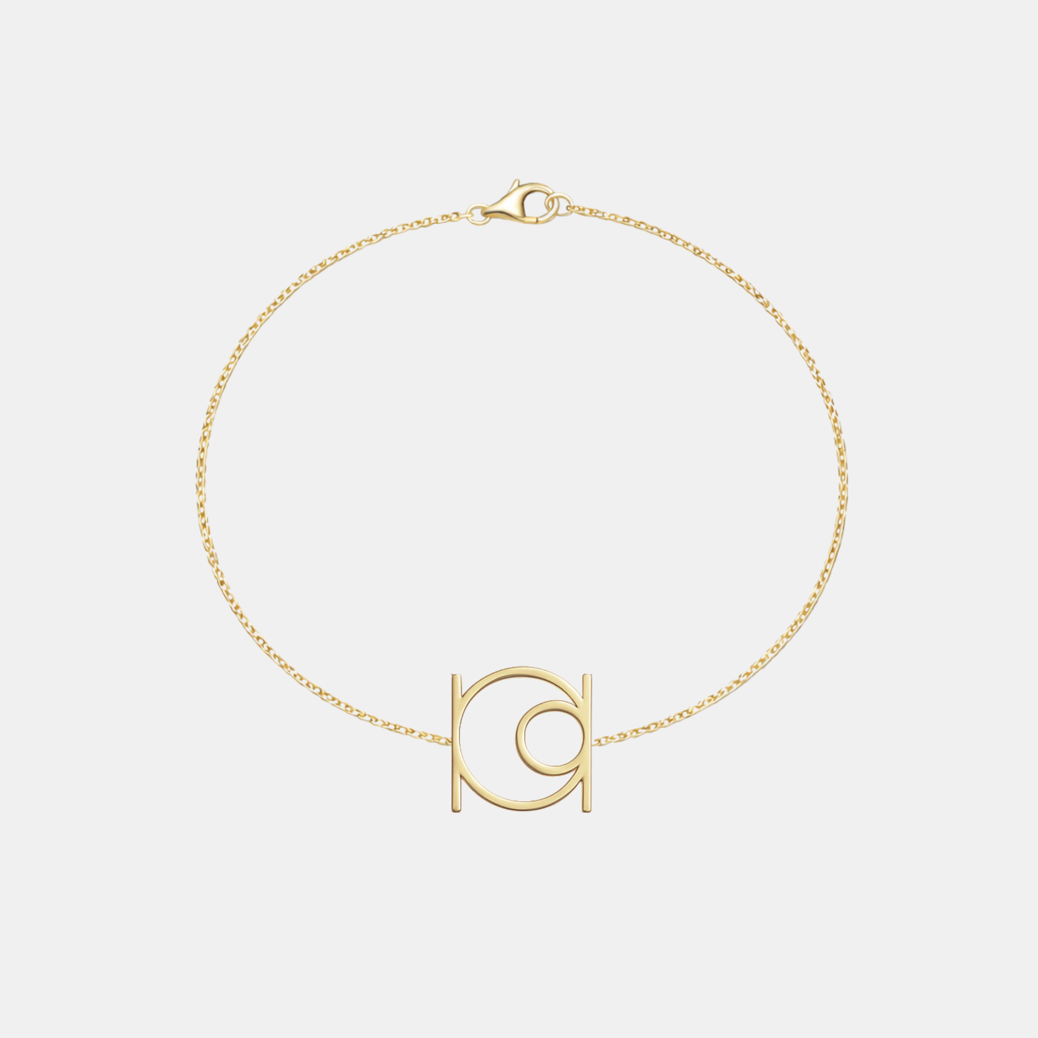 Minimalist 9k gold bracelet featuring a single custom geometric symbol on a delicate solid gold chain.