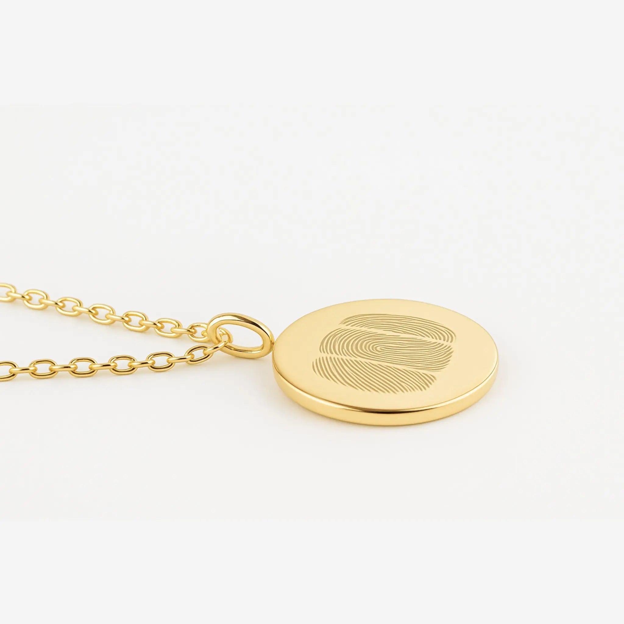 Luxury Three Fingerprint Coin Necklace in 18K Gold Vermeil by Danibydsgn, displayed on a soft white background. Features three precision-engraved fingerprints on a sleek gold pendant, representing love, connection, and craftsmanship. A timeless, custom piece designed for lasting elegance.
