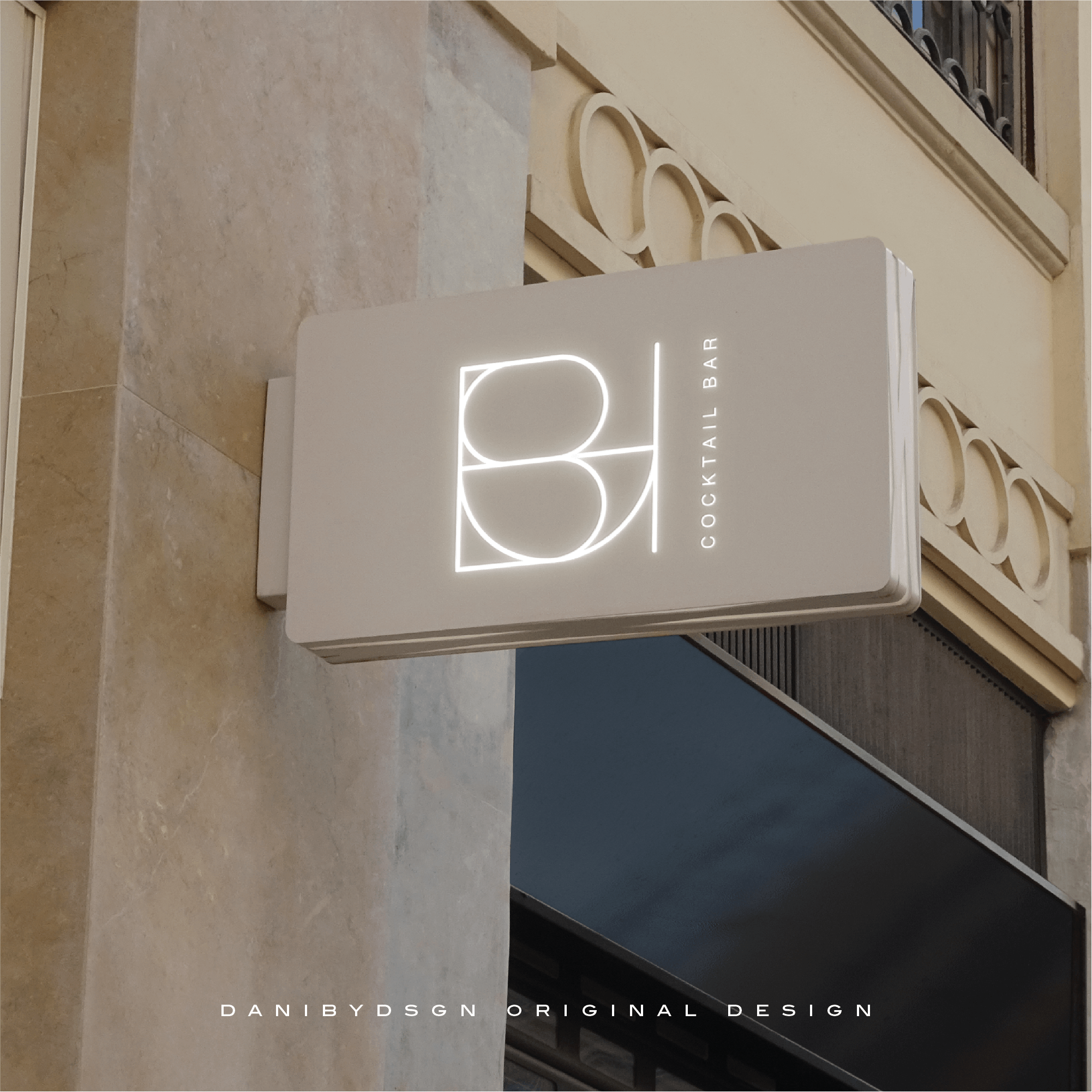 Illuminated 'BLUSH' logo design for our client Blush Cocktail Bar, from our Business Logo Design & Branding Kit by Danibydsgn, exemplifying premium business logo design and branding. Mounted on a classic building façade, it highlights brand identity, part of a branding package crafted by a skilled business logo designer. Our log designs are Ideal for website branding, wedding monograms and event promotions, this image conveys a luxe brand image.