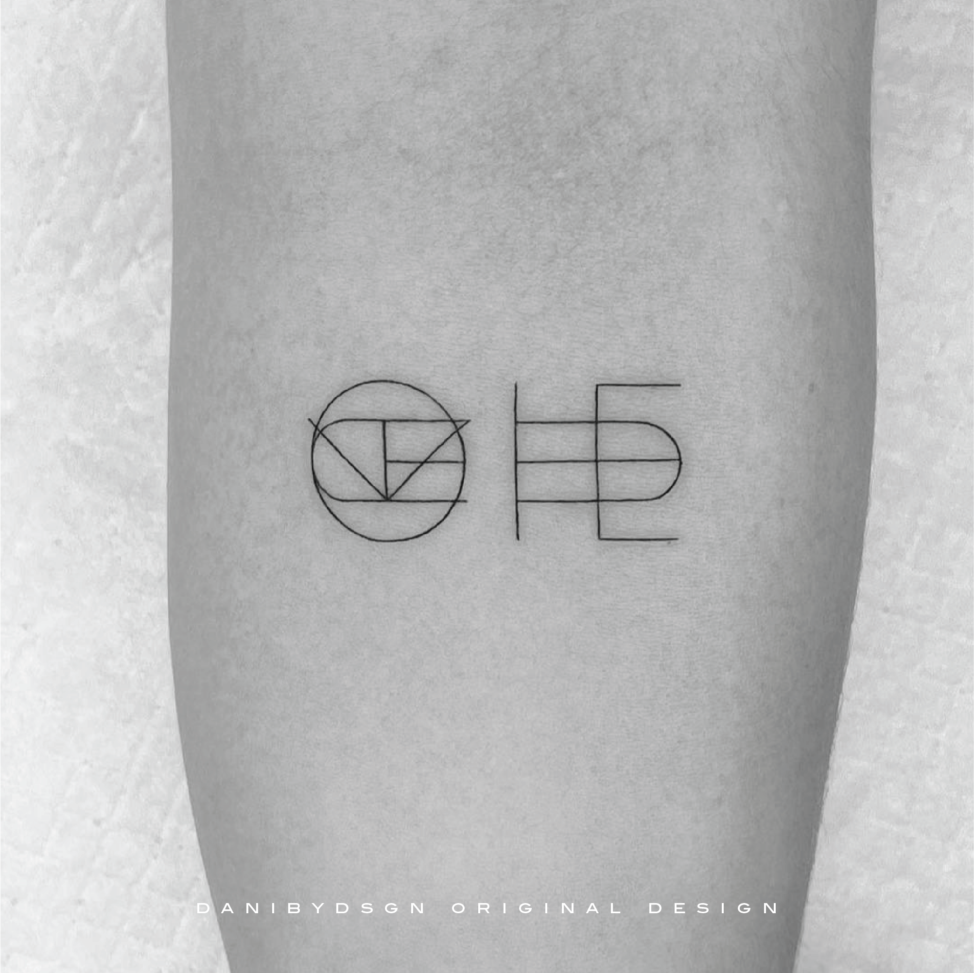 A distinct two symbol custom logo design used as an elegant fineline tattoo is a testament to Danibydsgn's expertise in name tattoo design and overlapping logo design. This crisp, monochromatic image captures a personalized approach to body art, reflecting the sophisticated simplicity found in Danibydsgn's name logos and custom name logo design portfolio. Danibydsgn is the original name logo creator with 30,000 personalized designs completed globally and over 1,700+ five star reviews. 