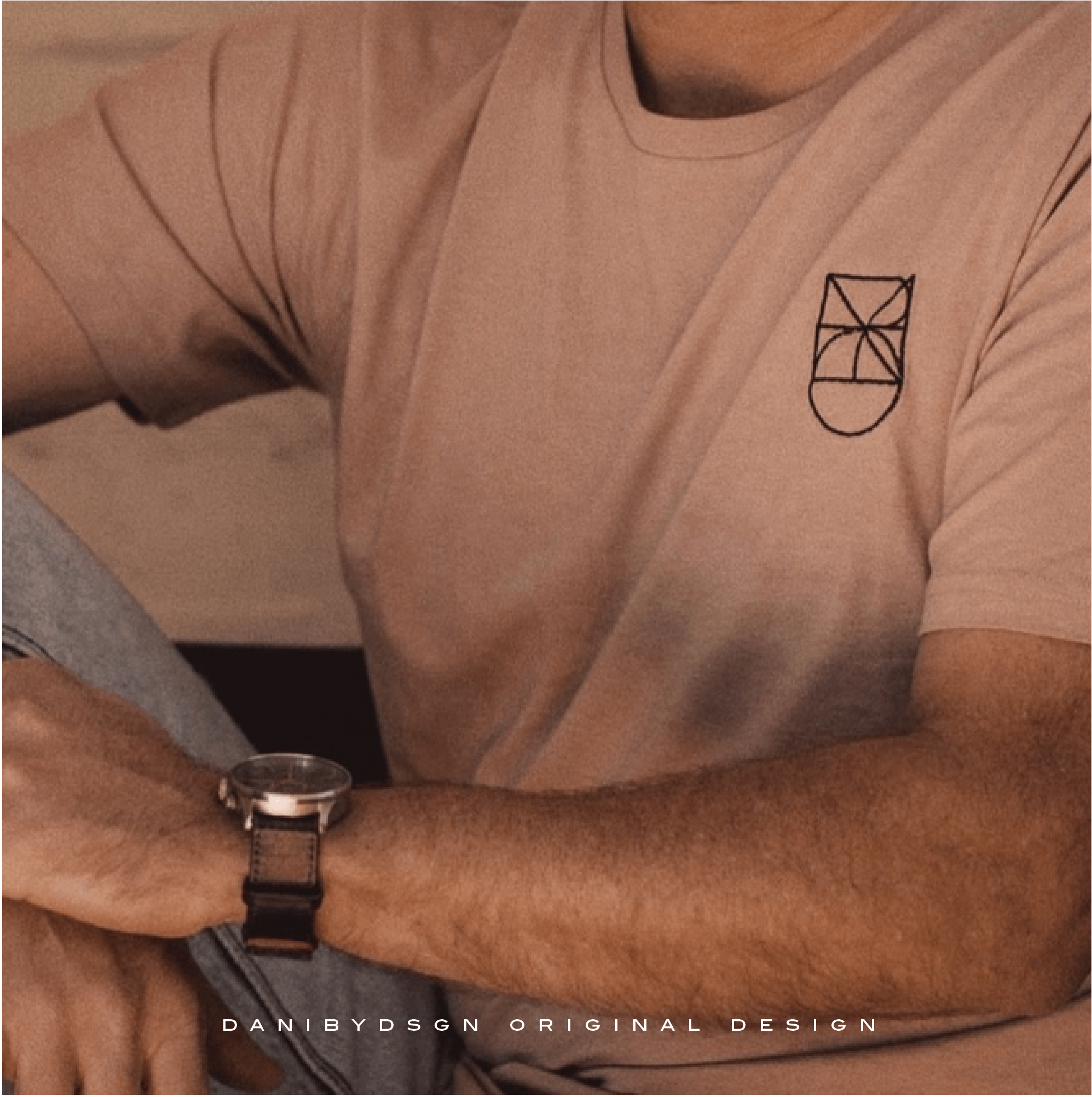 A casual t-shirt featuring an engraved geometric Business Logo Design by Danibydsgn, symbolizing a modern approach to clothing branding. This image highlights the artistry of business logo designers and the strategic expertise in business branding, specifically tailored for small business logo needs. The emblem illustrates logo identity and name logo design, ideal for website brand logo and clothing branding. Danibydsgn's work as a graphic designer is evident, reflecting high-standard branding