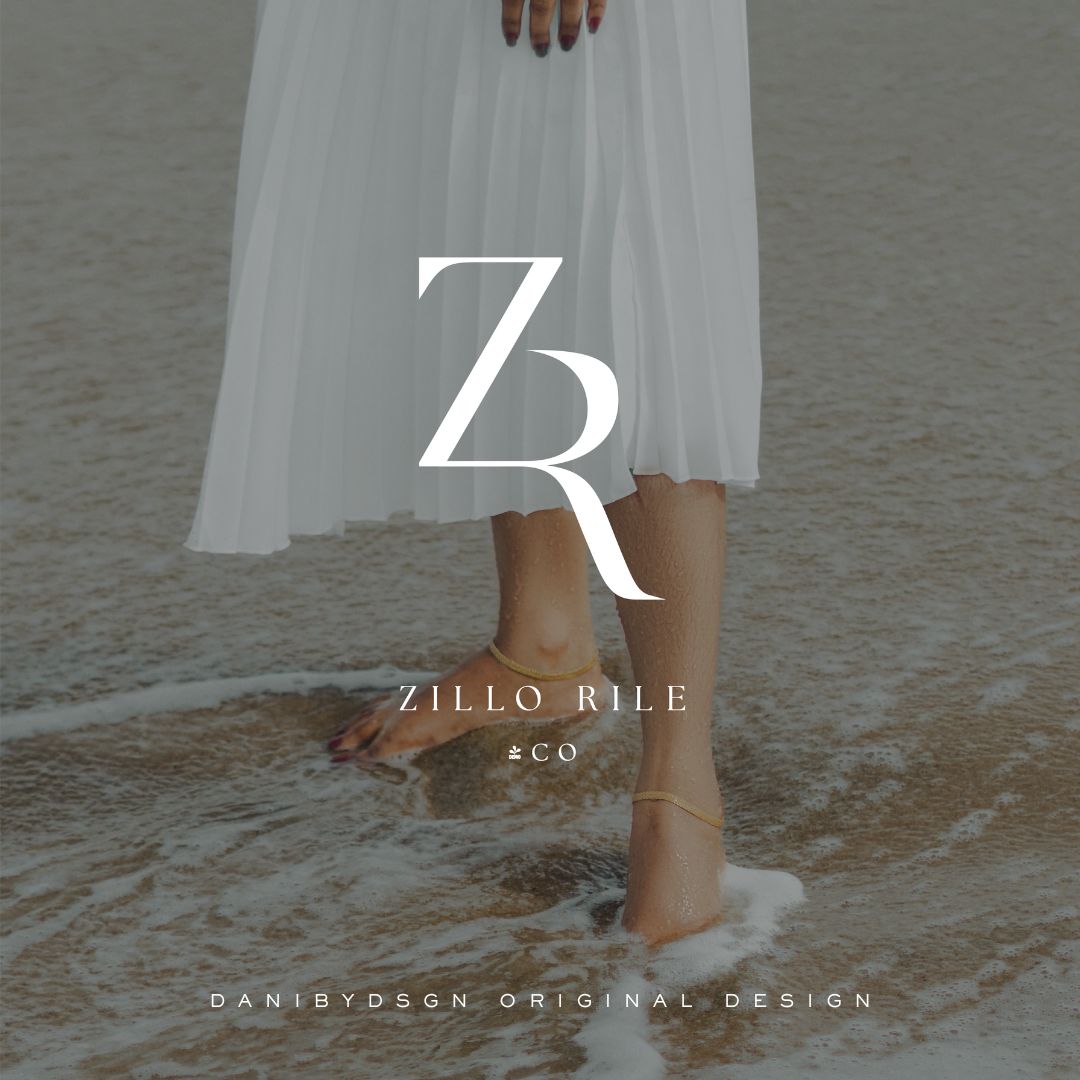 Promotional image for Zillo Rile & Co's of initials 'Z' & ‘R’ part of their business branding kit. The initial monogram, a Danibydsgn original design, is displayed against a serene backdrop. The photo captures the legs of a lady standing in the water, with the initial monogram showing a sophisticated brand identity. This design is ideal for website branding, wedding monograms and events, highlighting the bespoke business monogram logo and branding package kit offered by Danibydsgn, business logo designer.  
