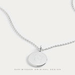 Our luxury bespoke Danibydsgn pendant necklace, elegantly created from 925 sterling silver and engraved with a Danibydsgn custom name logo creates a personal touch. As a refined engraved necklace and keepsake necklace, it's an impeccable choice for those seeking a custom engraved necklace or a stylish memorial necklace. Available also in premium 9ct gold and 18k gold vermeil, this necklace captures the essence of a personalized luxury, making it more than just a piece of jewelry but a cherished keepsake.