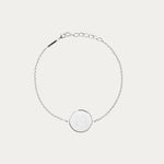 Our Sterling Silver Coin Bracelet, showcases a single symbol engraving - a Danibydsgn's custom logo design. This name engraved bracelet, with its delicate chain, is a quintessential romantic gift that merges intimacy with luxury. This custom engraved bracelet is for those seeking personalized silver bracelet designs. With the possibility of adding a unique touch, it becomes an engraved pendant bracelet that carries more than just style but also sentimental value, making it an exceptional meaningful gift