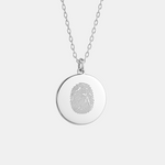Single Fingerprint Sterling Silver Pendant on a diamond cut chain on a light coloured background. 