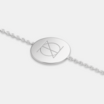 925 Sterling Silver bracelet with a circular pendant featuring a custom Danibydsgn single symbol design and bracelet is set on a white background