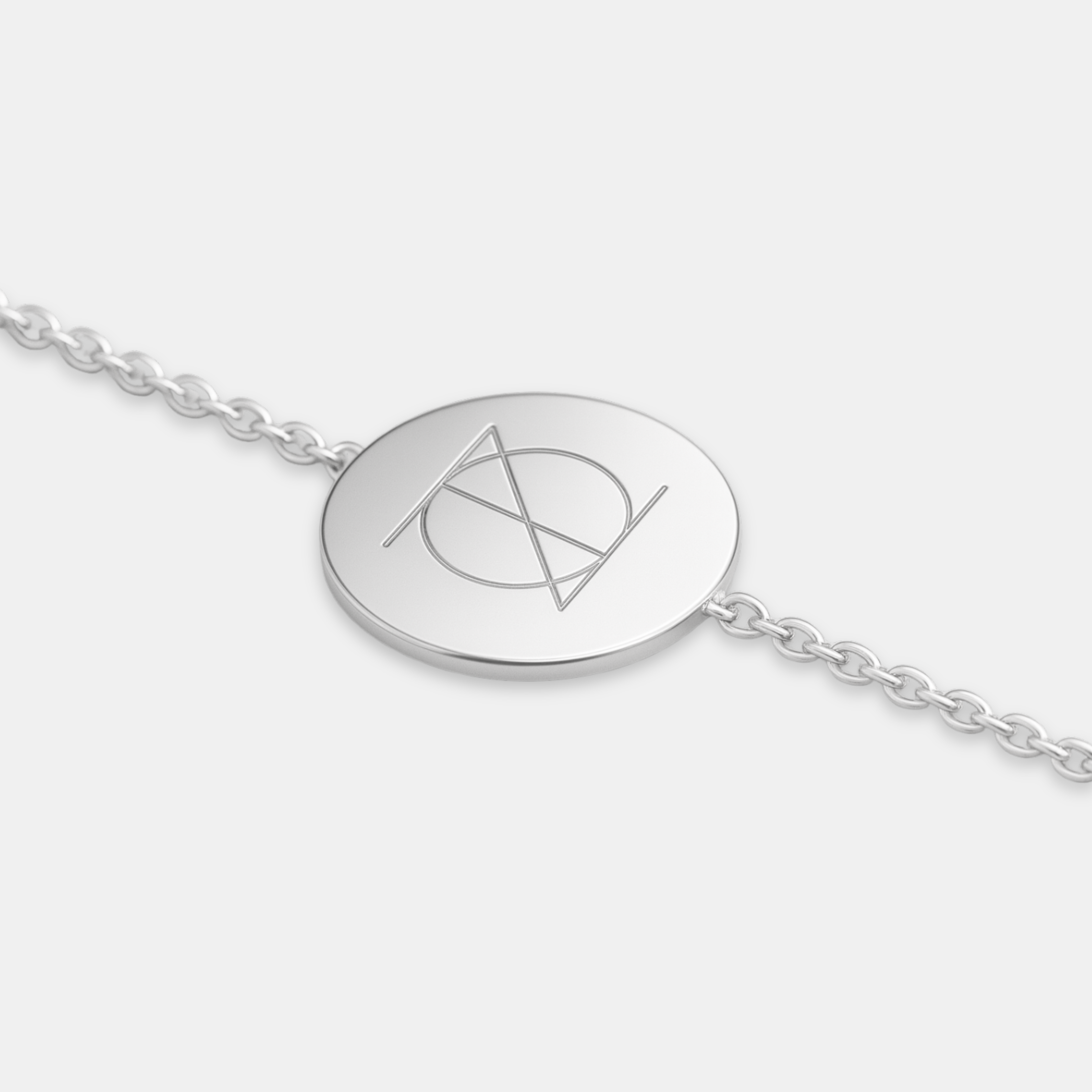 925 Sterling Silver bracelet with a circular pendant featuring a custom Danibydsgn single symbol design and bracelet is set on a white background