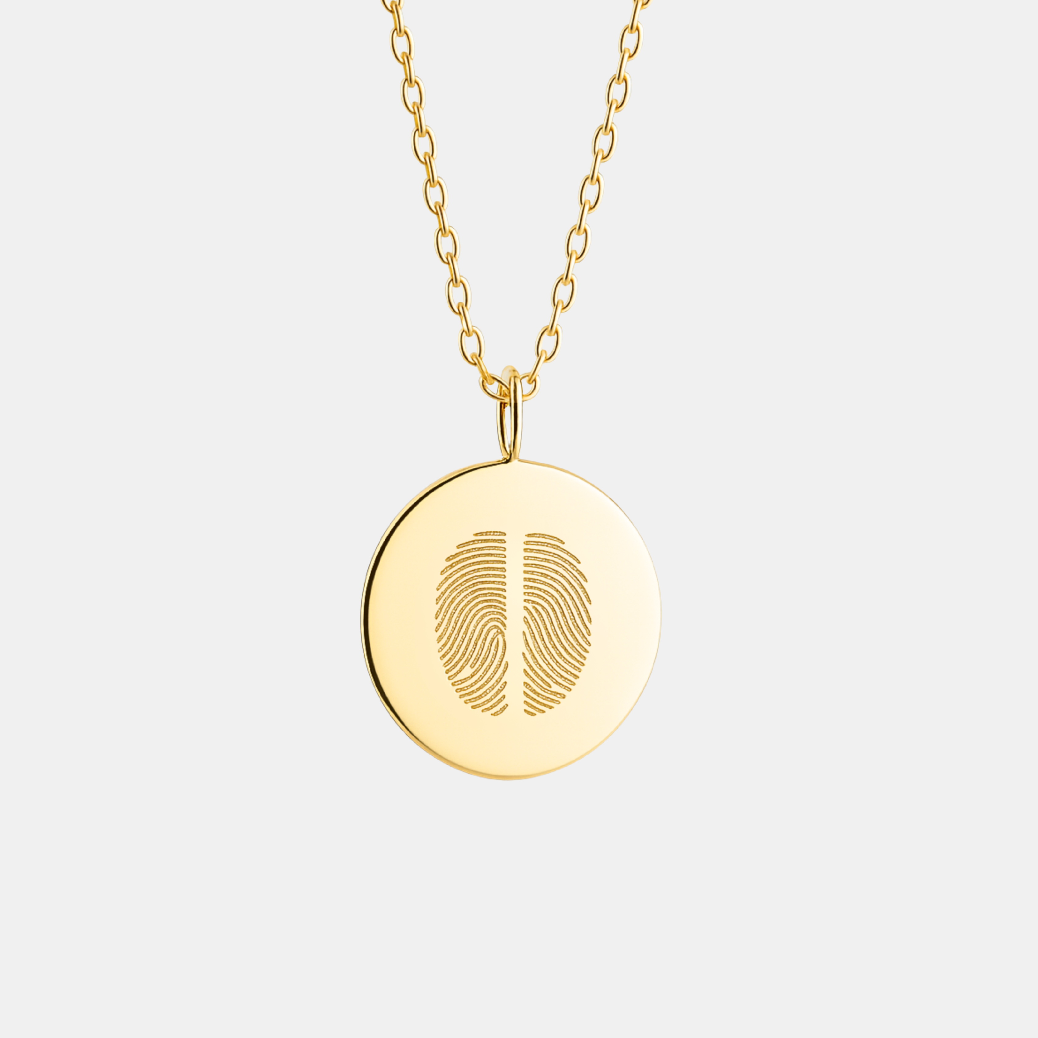 18k Gold Vermeil necklace with a round luxury coin pendant featuring a  two fingerprint design on a light gray background