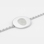 925 Sterling Silver bracelet with a circular coin pendant design engraved with one fingerprints, on a light background.