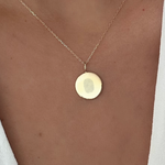 8k gold vermeil coin pendant necklace, featuring a single fingerprint design, dangles from an adjustable chain, embodying elegance and luxury. This engraved necklace is not only a piece of high-end engraved jewelry but also a meaningful personalized gift that holds sentimental value as memorial jewelry. The fingerprint engraving makes each necklace a unique memento.