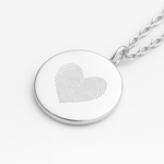 925 sterling silver  luxury coin pendant necklace with heart fingerprints engraved on the pendant and pendant is on a chain on a light coloured background