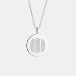 Silver necklace with a round pendant featuring a three fingerprint design on a white background and dainty cable chain.