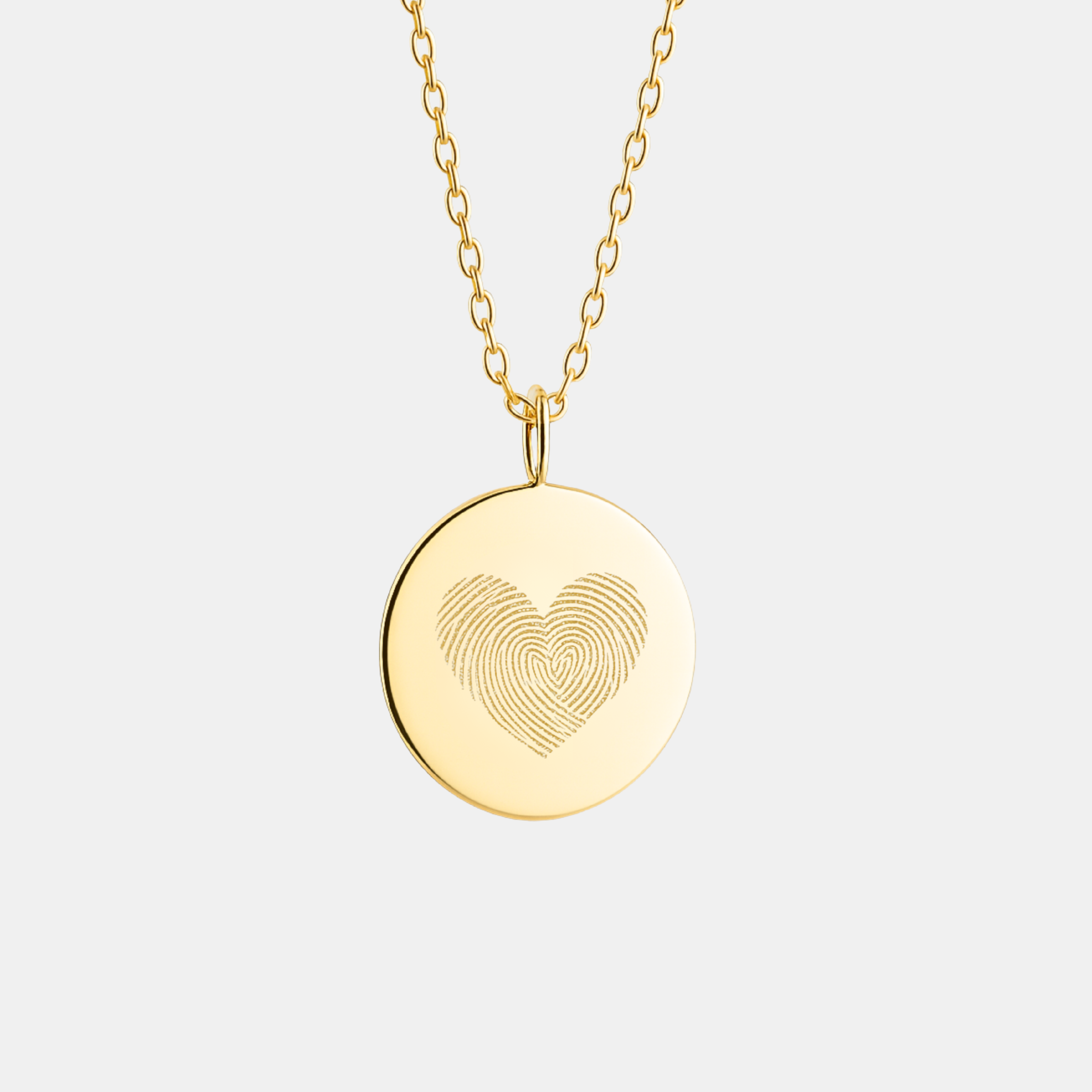 18k Gold Vermeil necklace with a round luxury coin pendant featuring an engraved two fingerprint, heart design on a light gray background