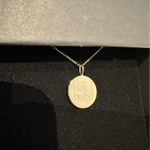 Exquisite Danibydsgn custom engraved necklace, showcasing a unique four-symbol name logo design engraved on an 18k gold vermeil coin pendant. Ideal for luxury jewelry enthusiasts looking for personalized name necklaces or a keepsake jewelry piece.  This necklace represents a bespoke and elegant choice for a memorable jewelry gift.