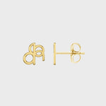 Close up photo of a pair of Danibydsgn custom symbol earings in lower case design, 9k gold and showing the backing of the earing and backing stud.  Photo is on a white background. 