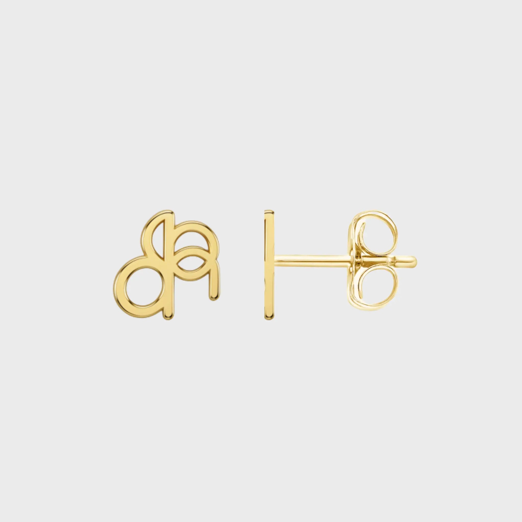 Close up photo of a pair of Danibydsgn custom symbol earings in lower case design, 9k gold and showing the backing of the earing and backing stud.  Photo is on a white background. 
