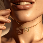 DaniByDsgn custom symbol necklace close-up on décolletage – personalized 9k yellow gold one-of-a-kind pendant, luxury bespoke symbol neckace