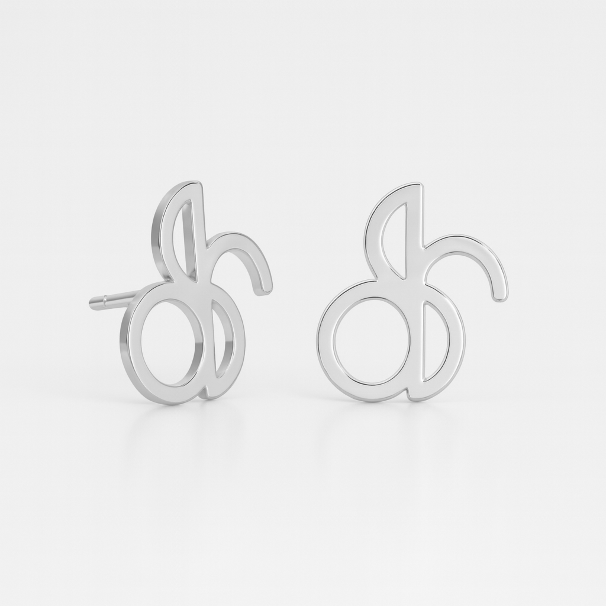 Danibydsgn custom symbol stud earrings in 925 sterling silver, featuring cut-out silhouette pendants from the customer’s Danibydsgn design (pair shown)