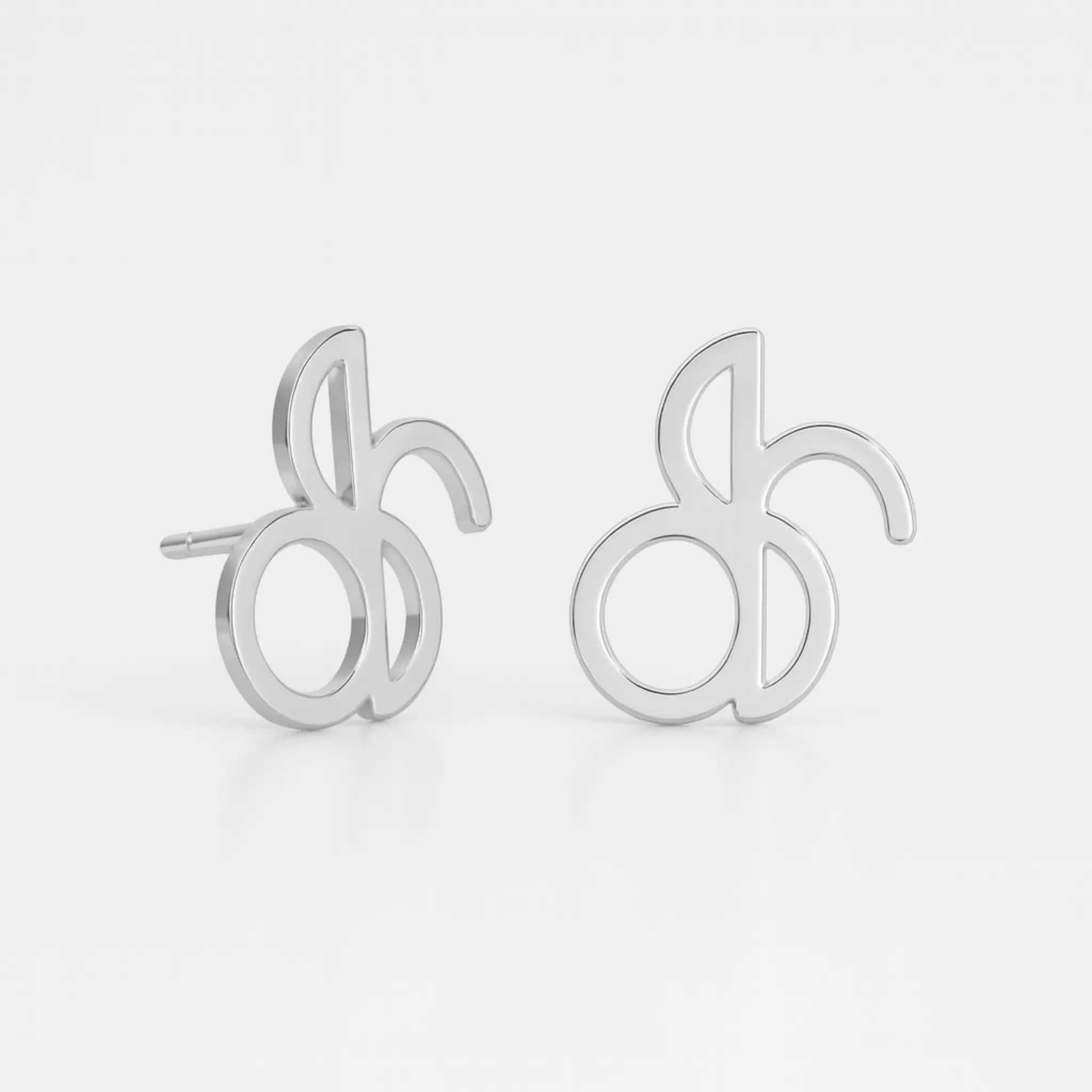 Danibydsgn custom symbol stud earrings in 925 sterling silver, featuring cut-out silhouette pendants from the customer’s Danibydsgn design (pair shown)