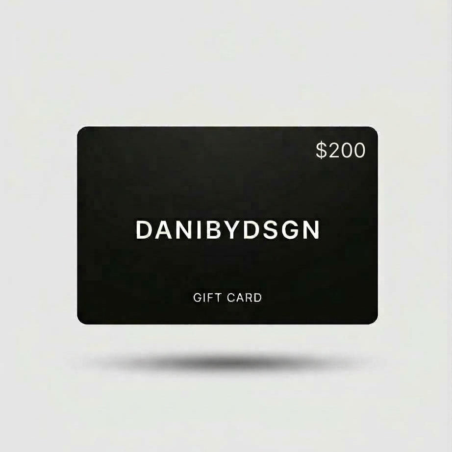 Close up of a Danibydsgn  $200 black digital gift card with 'DANIBYDSGN' branding and $200 in the top right hand corner of the card.  Card is set against a light background.  Digital e-gift cards from Danibydsgn.