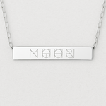 Close-up of the Danibydsgn engraved bar necklace in 925 sterling silver, showcasing the polished rectangular pendant with a detailed four-symbol geometric engraving and fine silver chain links on each side.