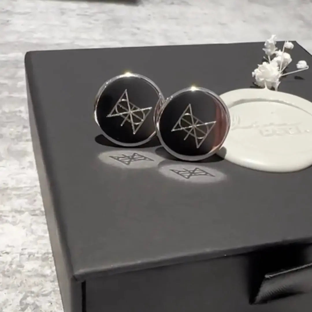 Engraved 925 sterling silver cufflinks by Danibydsgn with a custom logo design, showcasing elegant craftsmanship.