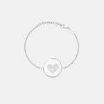 Studio photo of the Danibydsgn Heart Fingerprint Coin Bracelet in 925 Sterling Silver, featuring a circular pendant engraved with two fingerprints forming a heart design — a timeless symbol of love, connection, and remembrance.