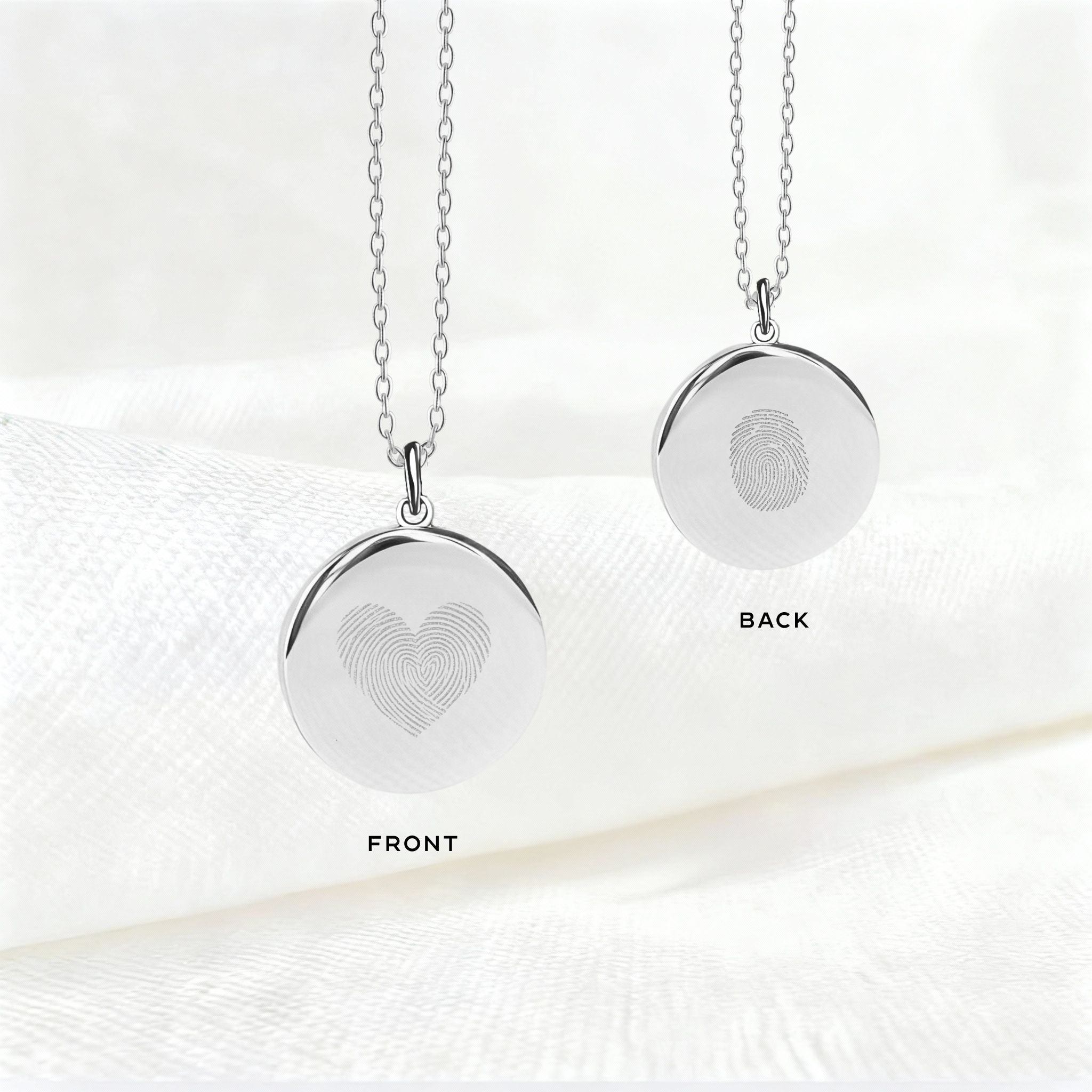 Danibydsgn Heart Fingerprint Necklace in 925 Sterling Silver showing front and back views — featuring a heart-shaped dual fingerprint engraving on the front and a single fingerprint detail on the back for a personal, timeless keepsake.