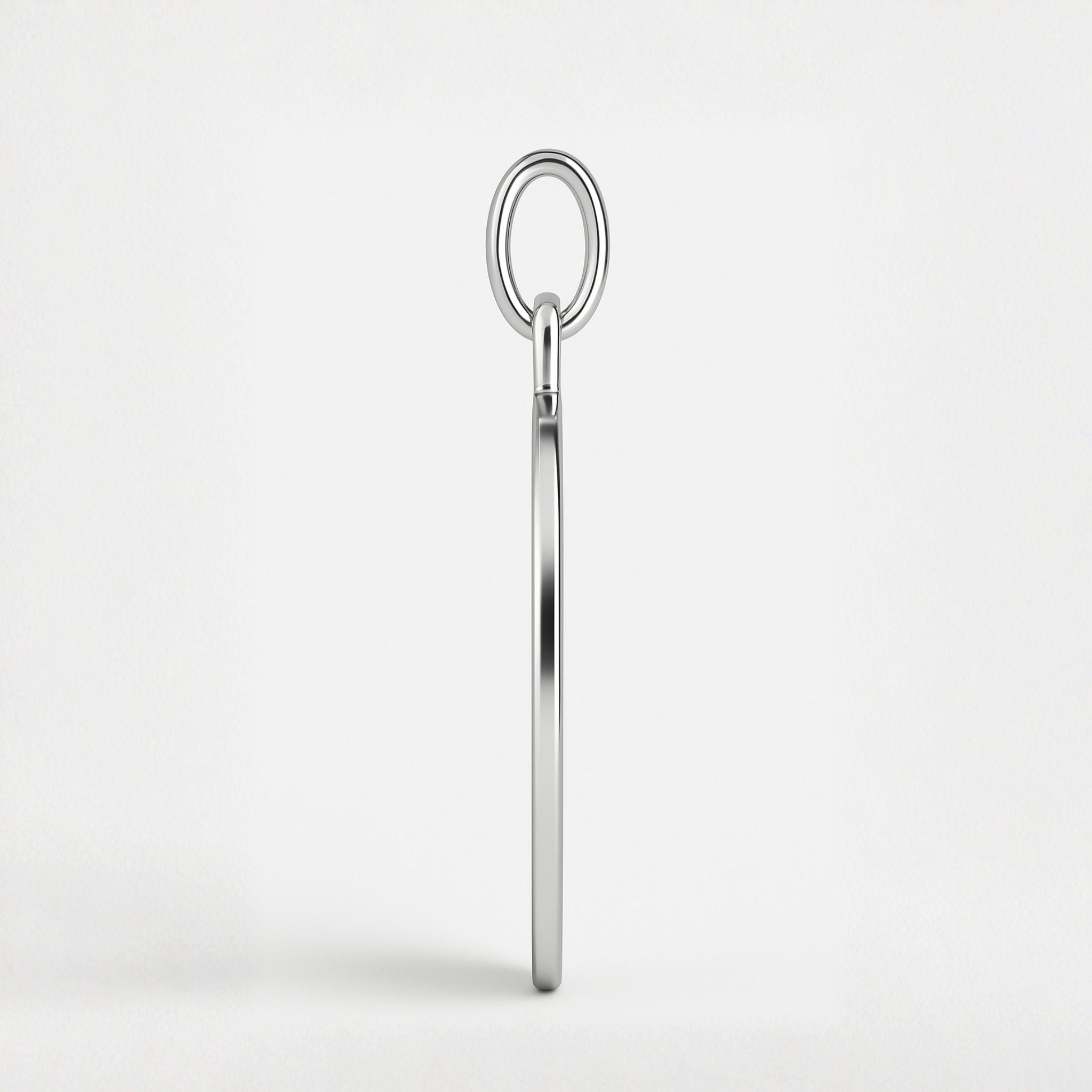 Side view of Danibydsgn Heart Fingerprint Pendant Necklace in 925 Sterling Silver showing the pendant’s refined 1.5mm depth and sleek polished edge, crafted for durability and timeless elegance.