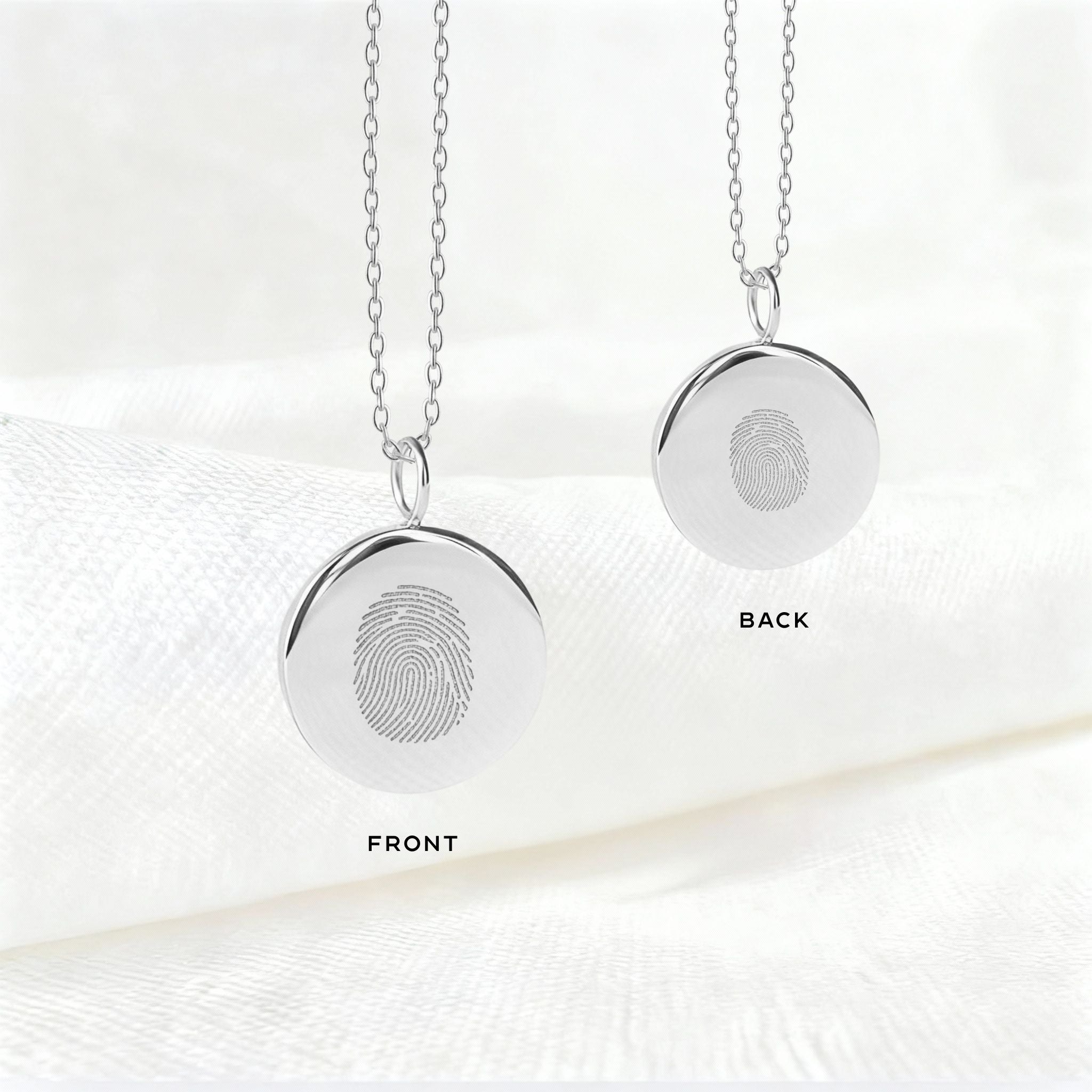 The Danibydsgn Single Fingerprint Coin Necklace in 925 Sterling Silver, featuring a mother’s fingerprint on one side and her baby’s on the other. A deeply sentimental keepsake symbolising the unbreakable bond between mother and child, crafted with refined elegance and timeless detail.