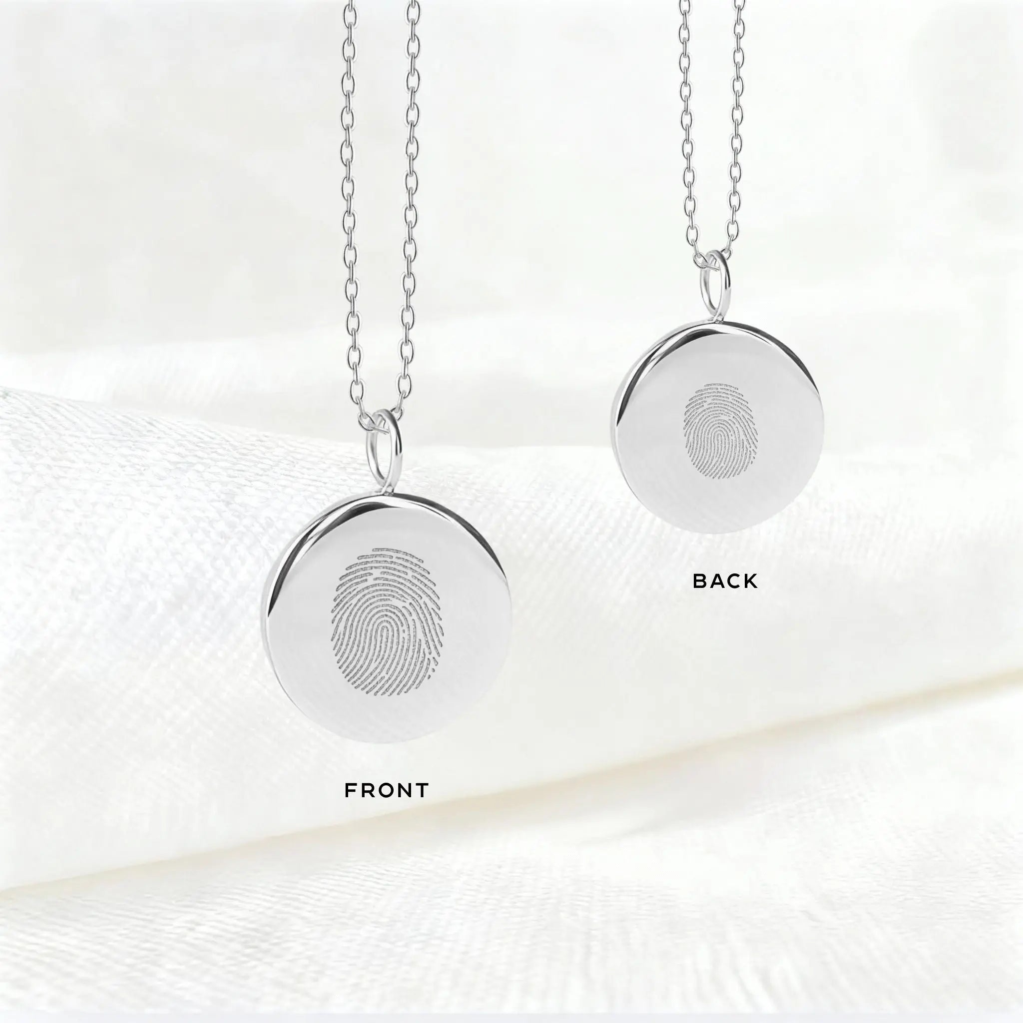 Front and back view of Danibydsgn single fingerprint coin necklace in 925 sterling silver, showcasing intricate details.
